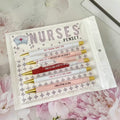 Five nurse-themed ballpoint pens with humorous medical copywriting on plastic barrels