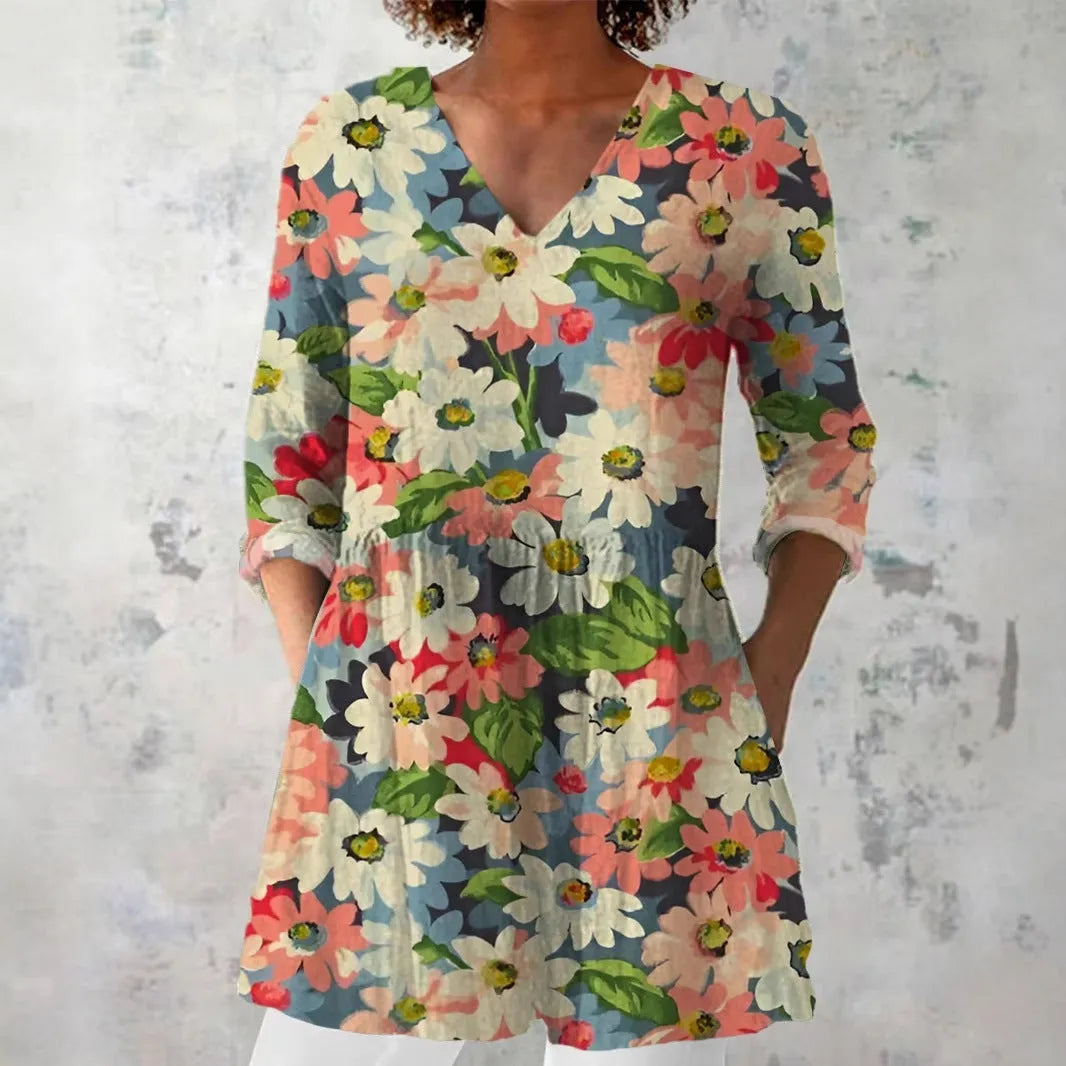 Women's slim-fit retro printed long-sleeved polyester top on a hanger, showing detail of digital print.