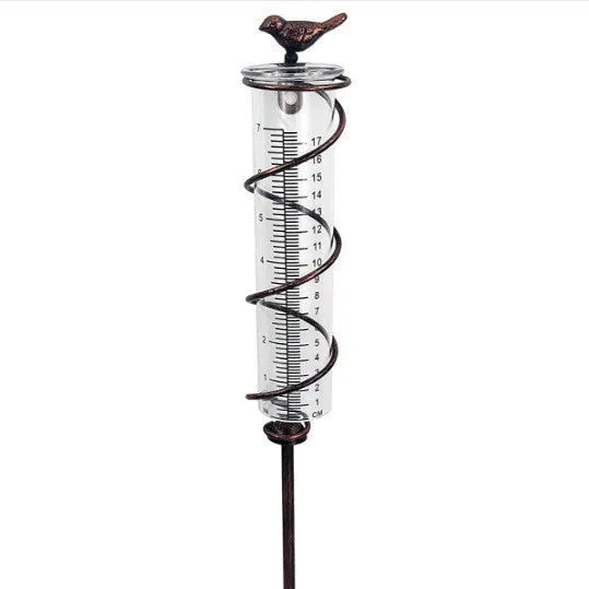 Traditional cast iron stand with bird-shaped glass rain gauge for garden precipitation measurement