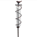 Traditional cast iron stand with bird-shaped glass rain gauge for garden precipitation measurement