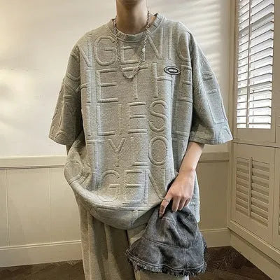Men's grey retro loose fit T-shirt with raised three-dimensional letter pattern on front