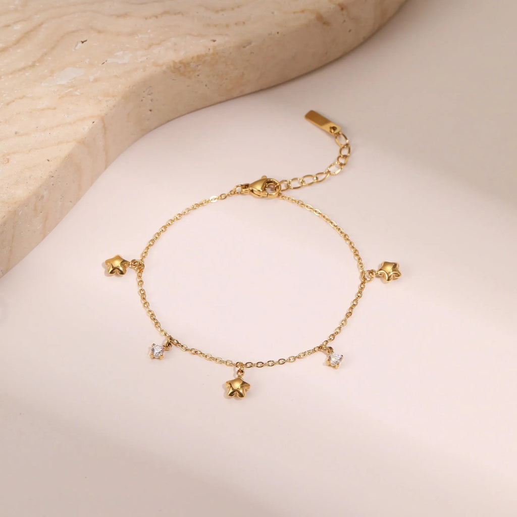 Ins Titanium Steel women's bracelet with 18K gold plating and a geometric zircon star pendant.