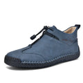 Men's casual leather shoe in green with a tall crown, round toe, mid heel, and rubber sole.