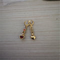 A pair of women's heart-shaped alloy earrings with an electroplated gold or silver finish.