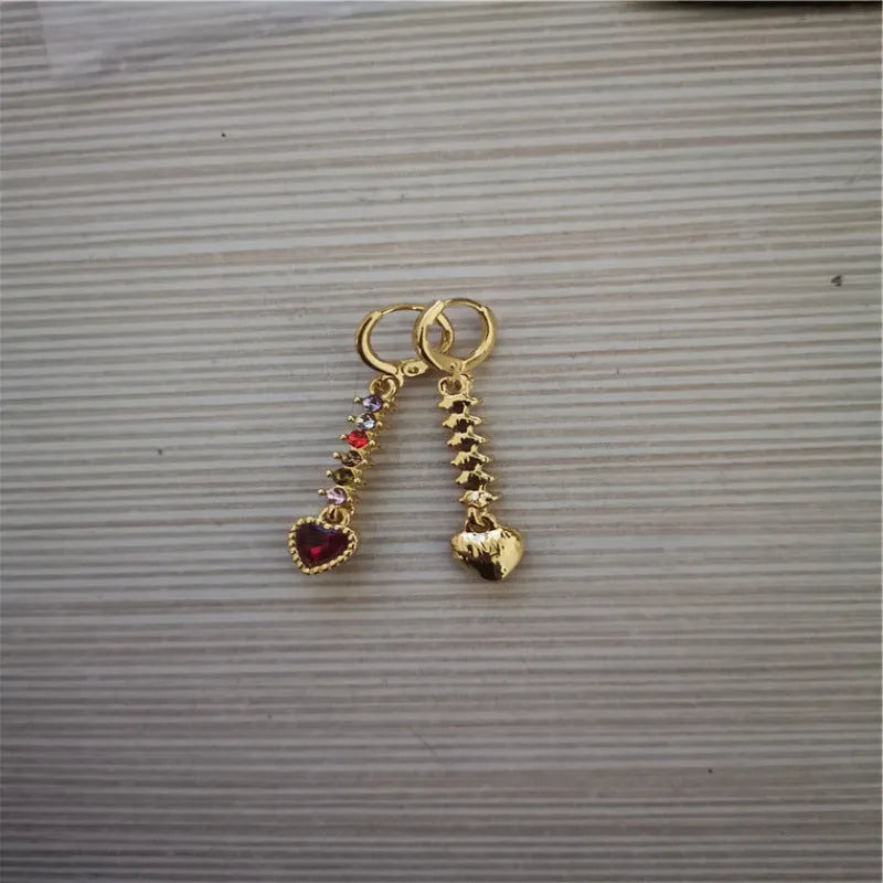 A pair of women's heart-shaped alloy earrings with an electroplated gold or silver finish.