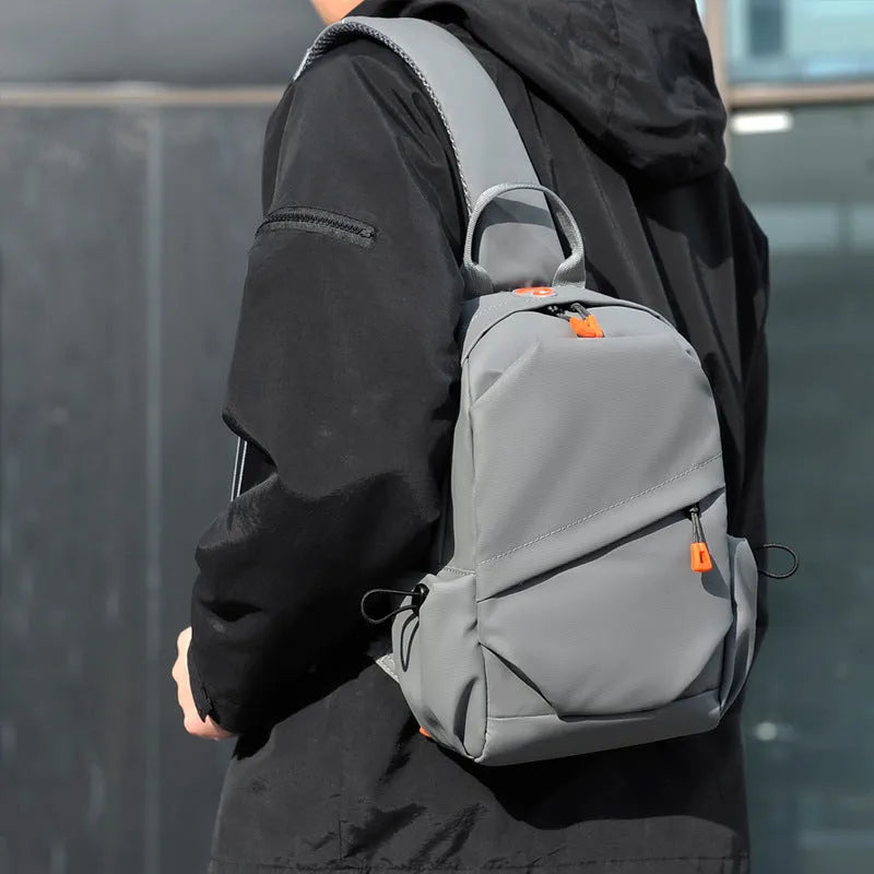 Men's black casual crossbody bag with a single shoulder strap made from polyester.