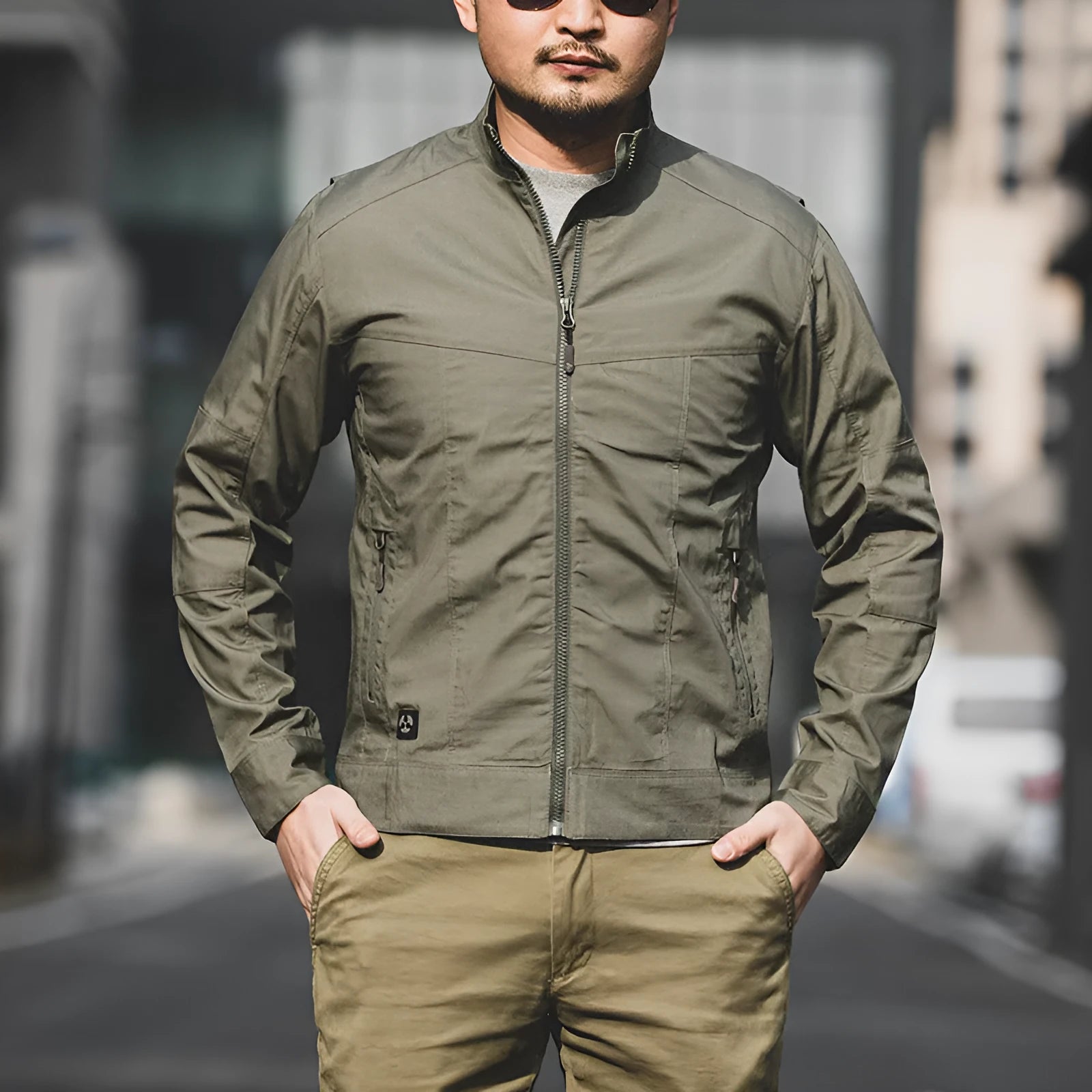 Men's brown tactical assassin jacket with camouflage pattern and multiple pockets.