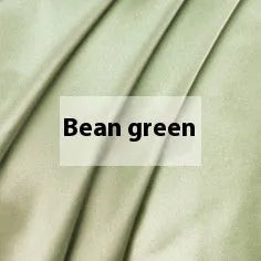 Double-sided silk duvet cover in bright brown colour, shown on a bed.