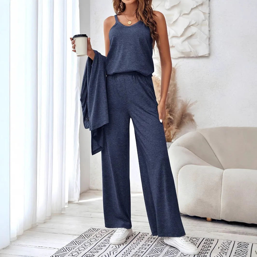 Blue women's three-piece suit set with sling top, long cardigan and trousers on hanger