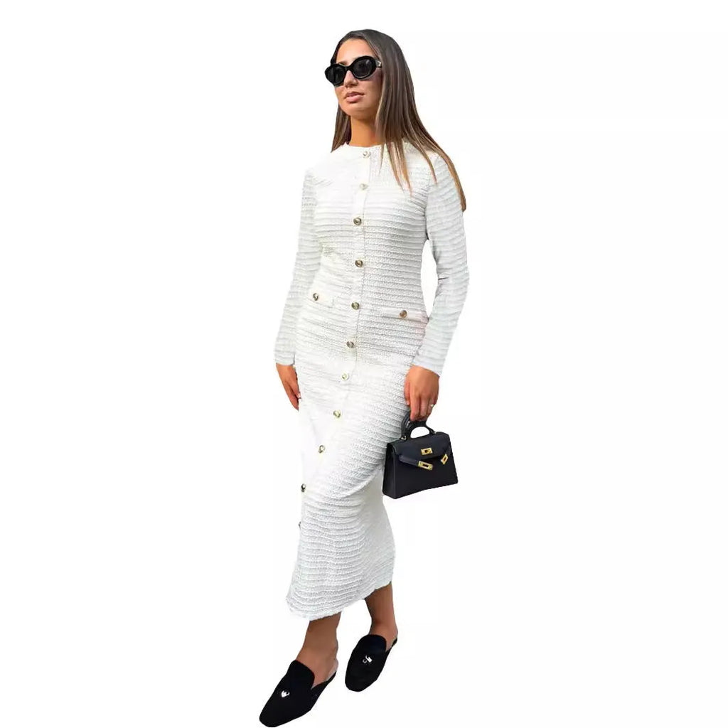 French retro slim fit knitted long-sleeved pullover dress in black with button accents and a one-step skirt.