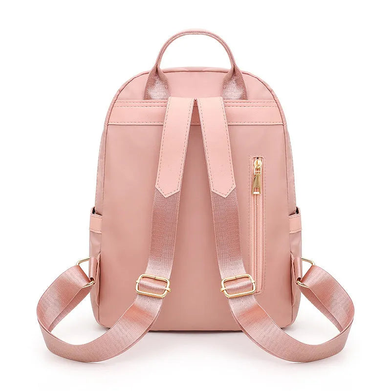 Women's black waterproof casual backpack with double shoulder straps and internal organisation compartments