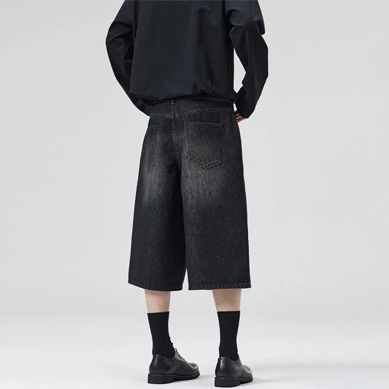 Men's straight-leg cotton denim shorts in cropped length on a casual model
