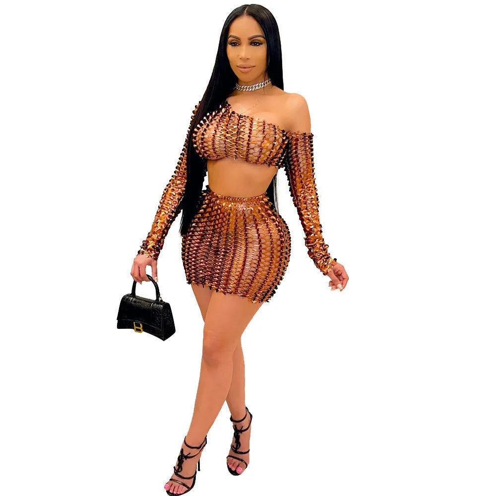 Women's black hollow-out net two-piece dress set with sleeveless top and short skirt.