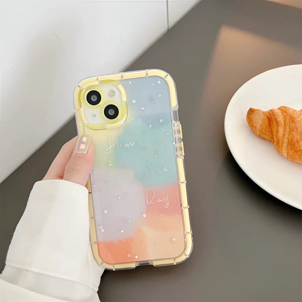 Minimalist yellow-edged silicone phone case for iPhone on a table, showing precise cut-outs for camera and ports.