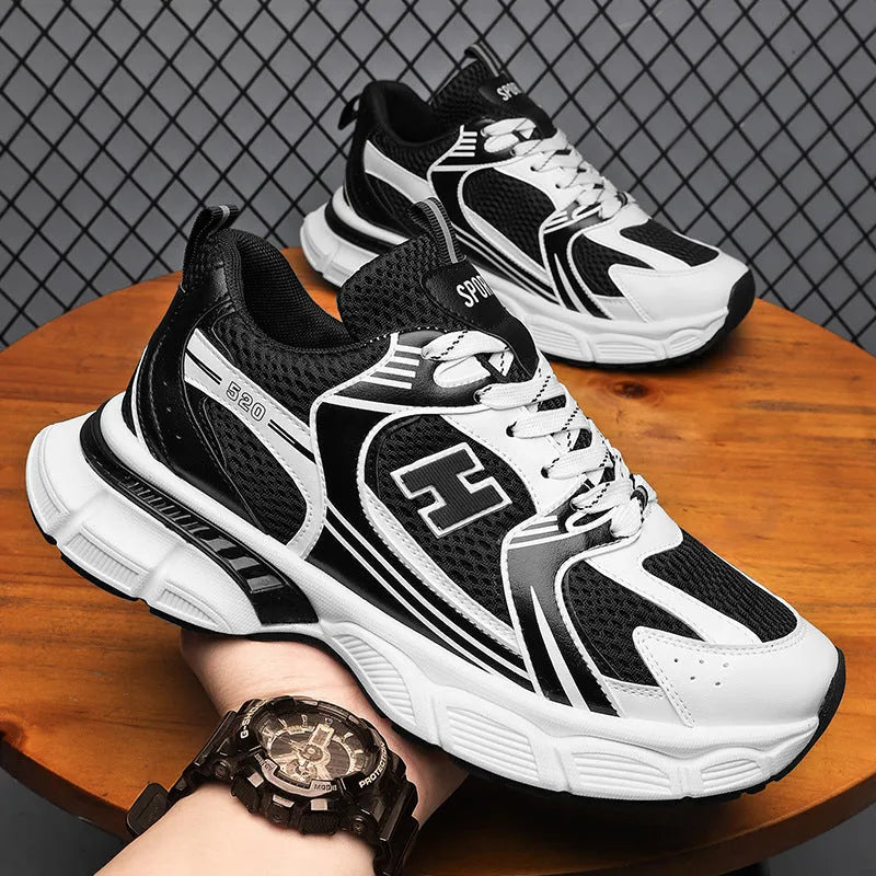 Men's white and grey mesh running shoes with round toe and plastic sole.