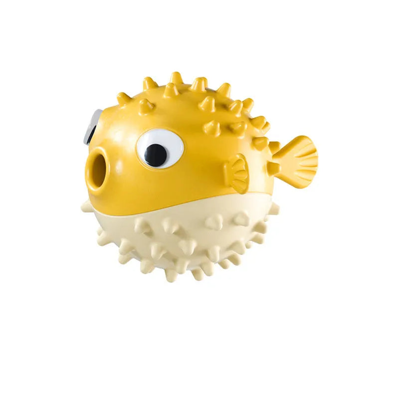 Green fish-shaped dog toy with textured surface for dental cleaning and treat dispensing