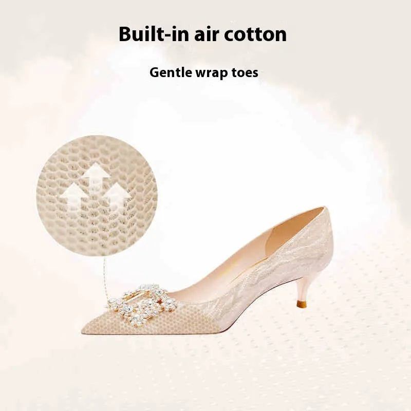 Champagne gold women's pointed-toe stiletto heels with rhinestone detail on the upper.
