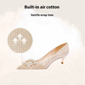 Champagne gold women's pointed-toe stiletto heels with rhinestone detail on the upper.