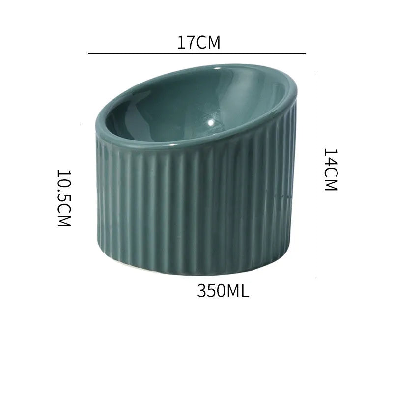 A dark green round ceramic cat bowl elevated on a base, shown at an angle.