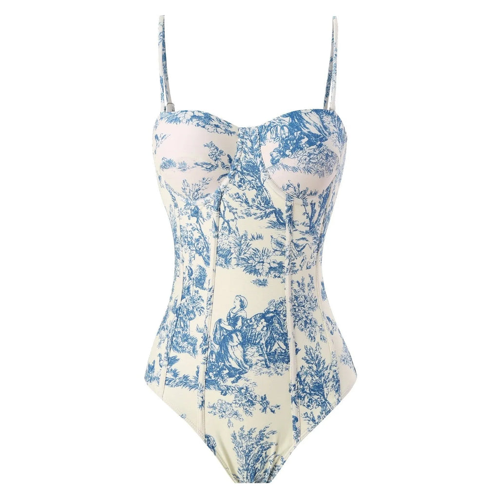 Blue patterned one-piece swimsuit for women shown with an optional matching gauze skirt.
