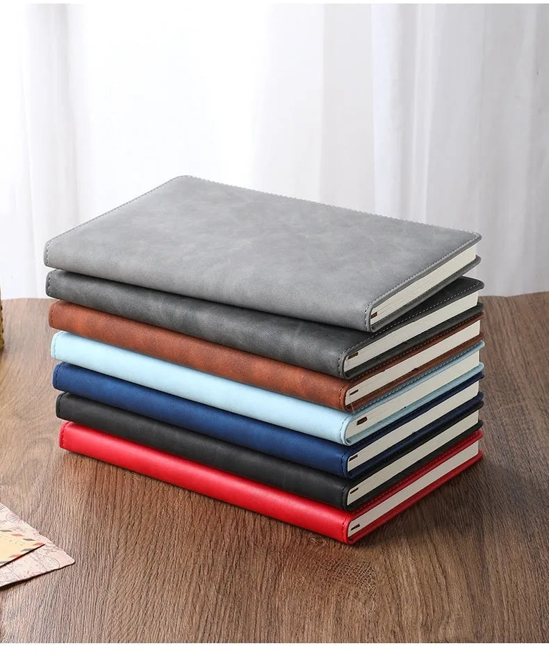 A5 notebook with imitation leather cover in multiple colour options including black, red, green, blue, and orange.