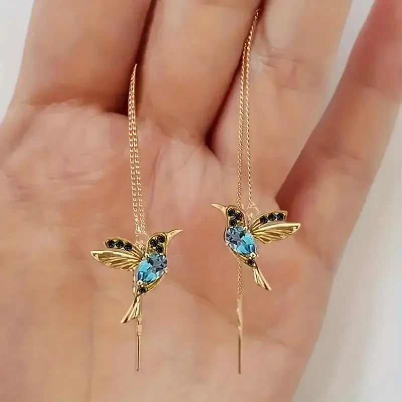 Bird hanging earrings with zirconium wings in long drop style