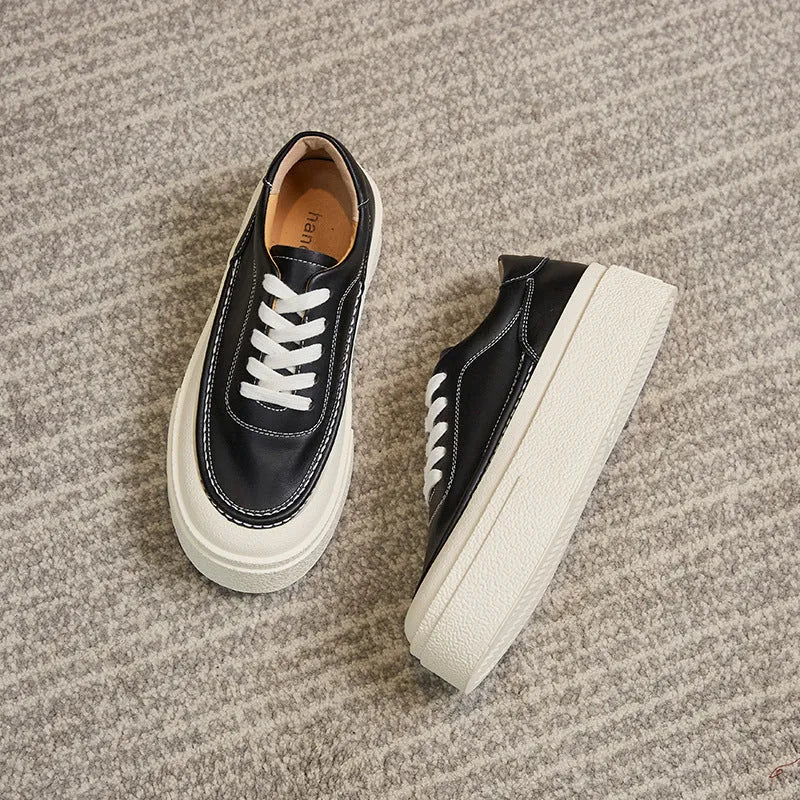 Women's black platform casual sports shoes with embossed cowhide upper and round toe design