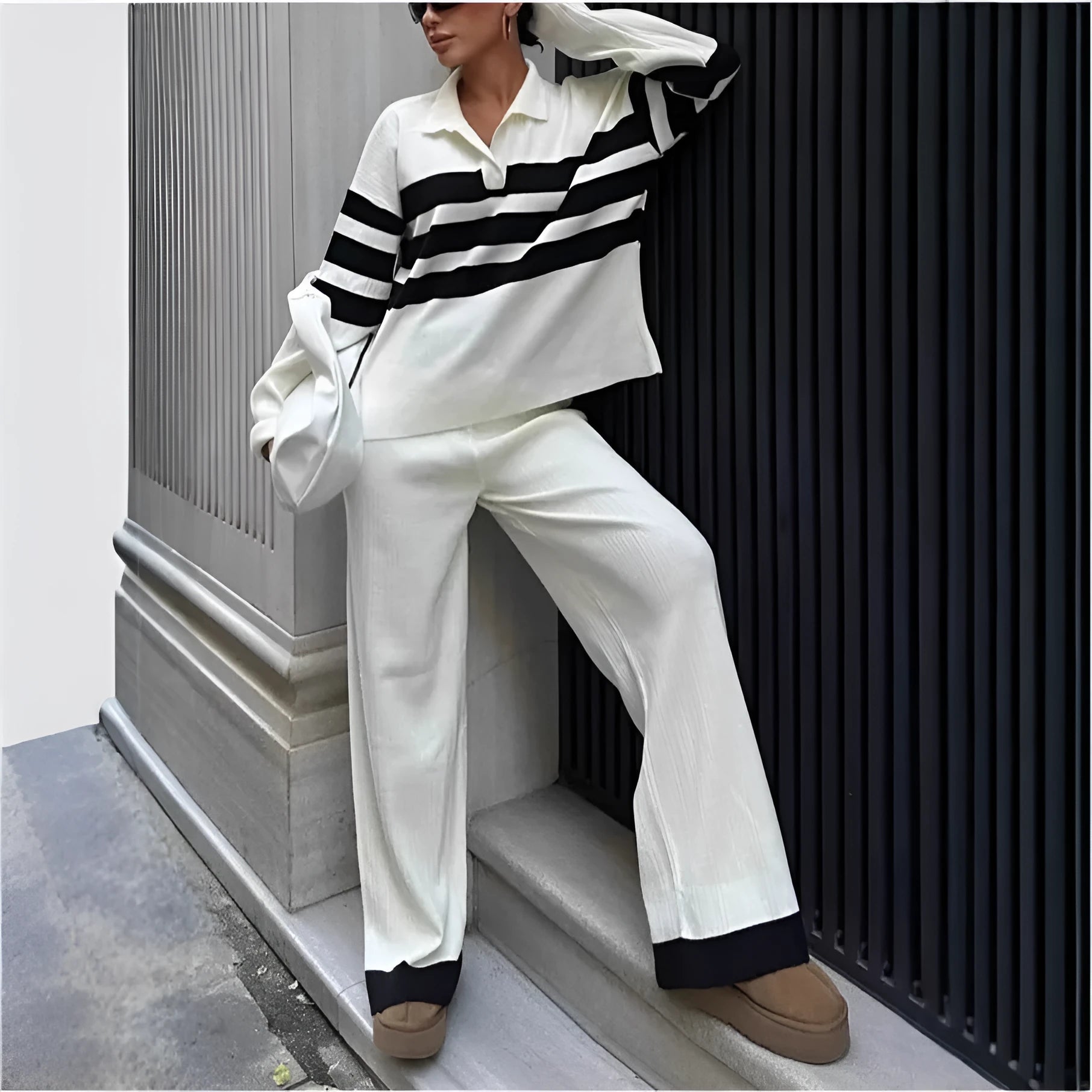 Women's black and white striped knitted polo shirt with matching trousers two-piece set