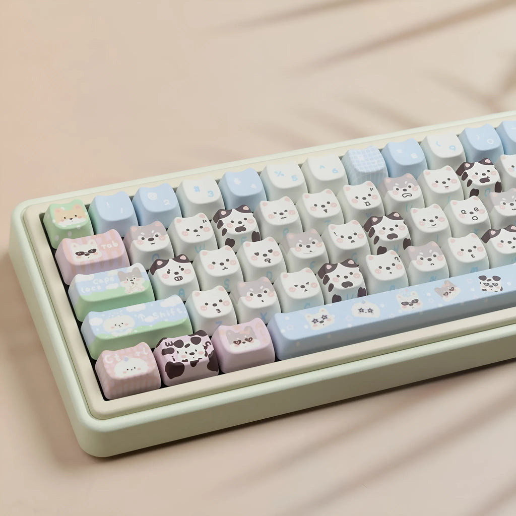 PBT sublimation key cap set showing colourful cat and puppy character designs on mechanical keyboard keys