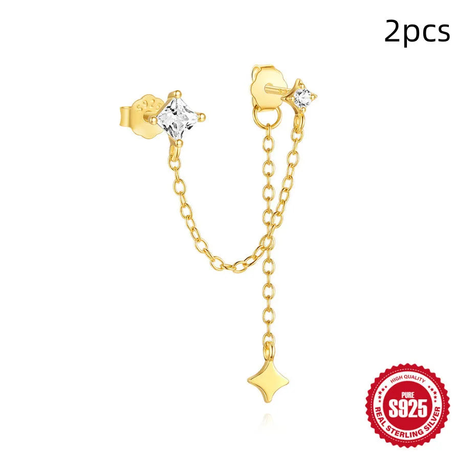 Close-up of a golden double ear piercings chain design stud earring made from S925 sterling silver with inlaid zircon stone.