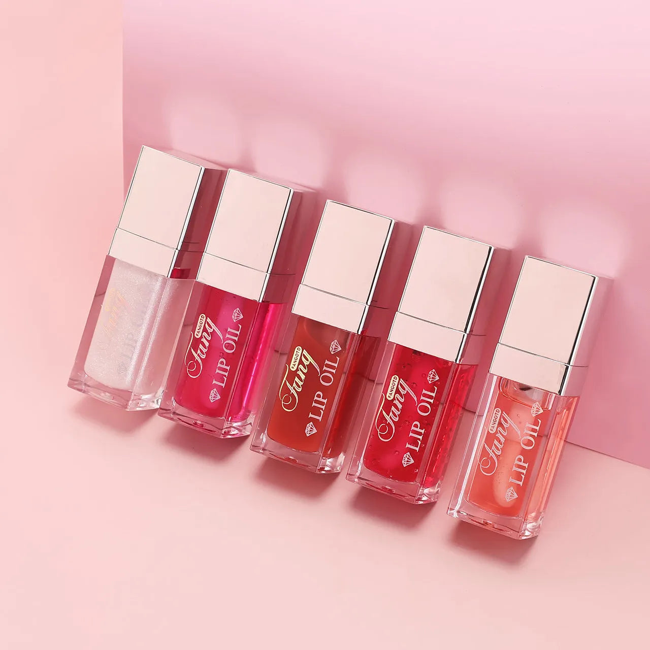 Five tubes of bright lip gloss mint lipstick in shades 001, 006, 007, 012, and 015.