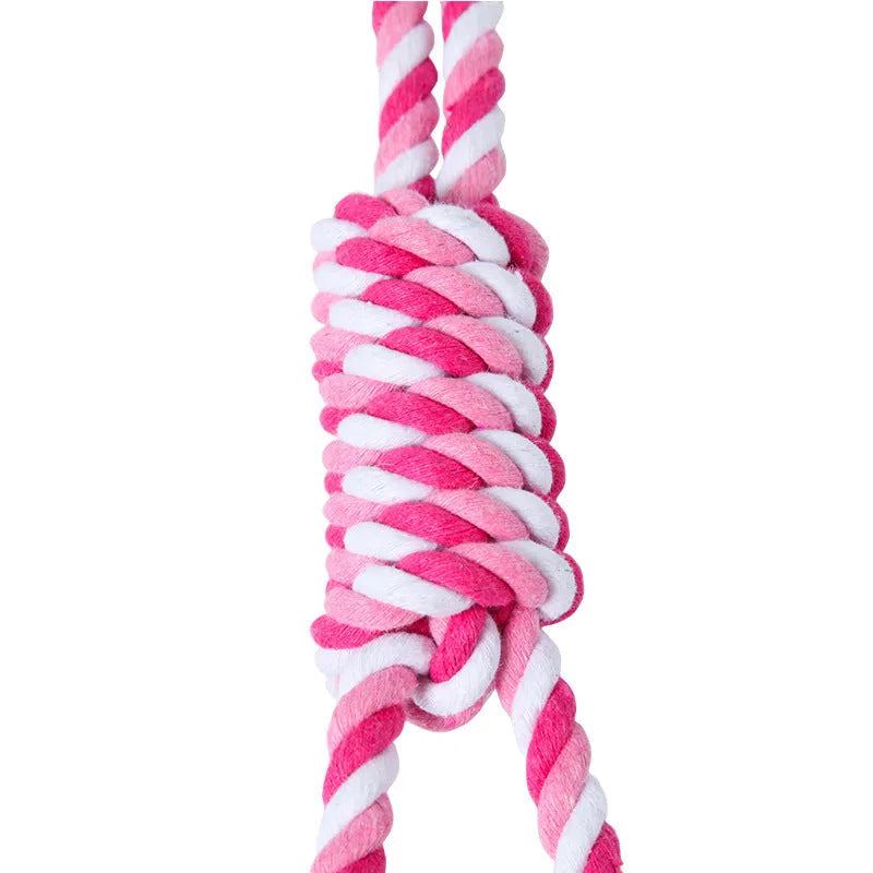 A red and white cotton string dog toy, approximately 38cm long, for medium and large dogs.