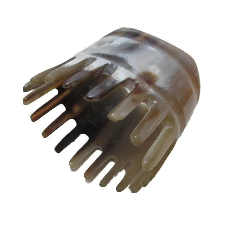 White buffalo horn comb with half-wide teeth and pointed tips for shampoo distribution and scalp massage