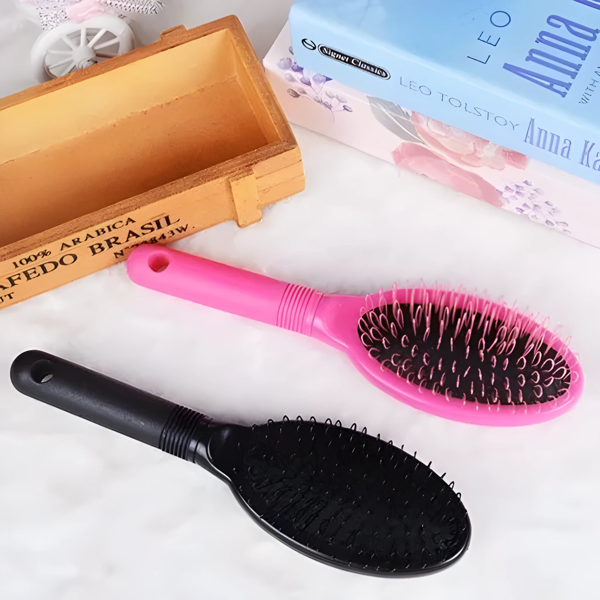 Black or pink plastic ring tooth hair extension comb with airbag cushion measuring 22x6cm