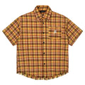 Yellow grid plaid short sleeve shirt with an embroidered chest pocket, shown in a loose unisex fit.