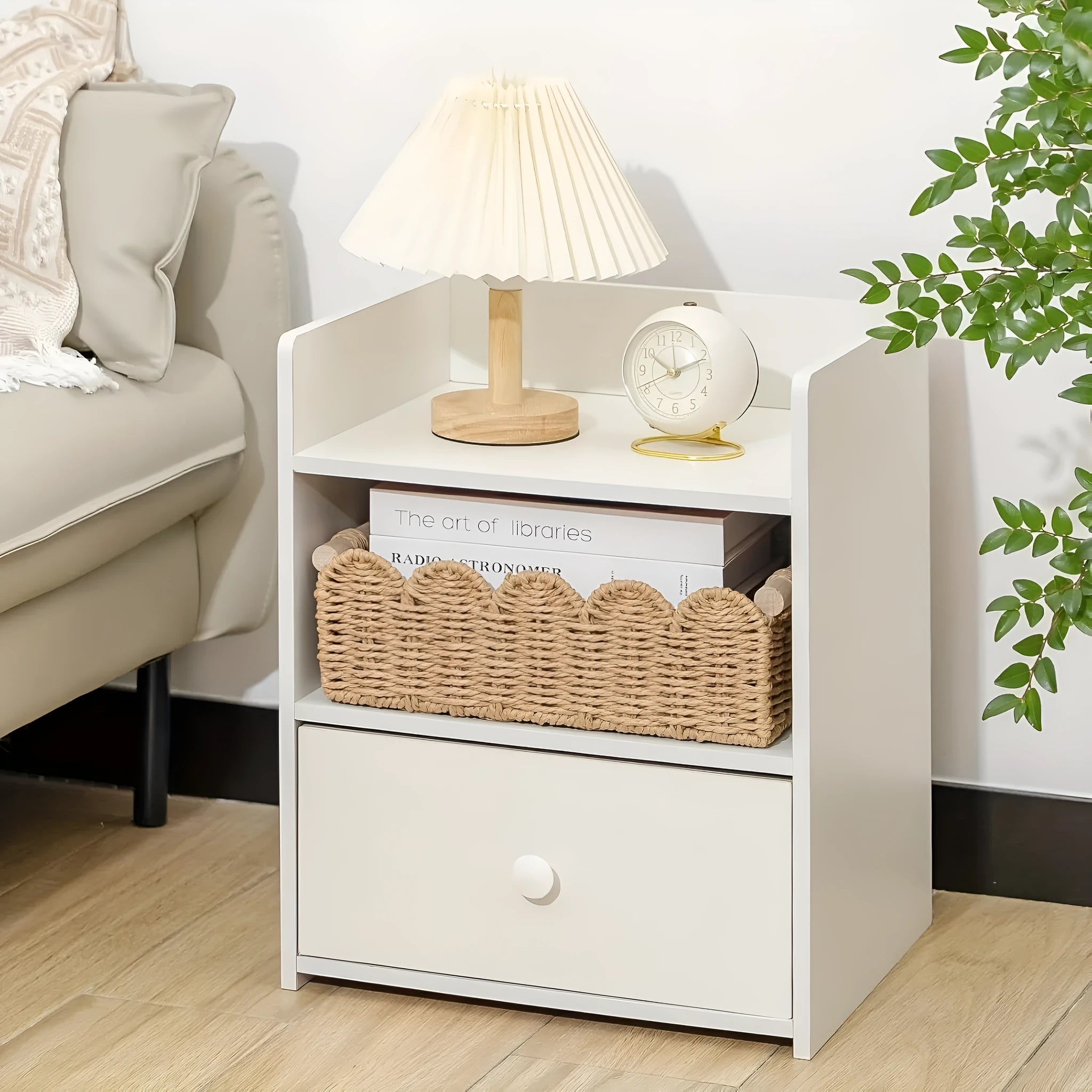 Rectangular woven paper storage basket in a choice of colours on a wooden table.