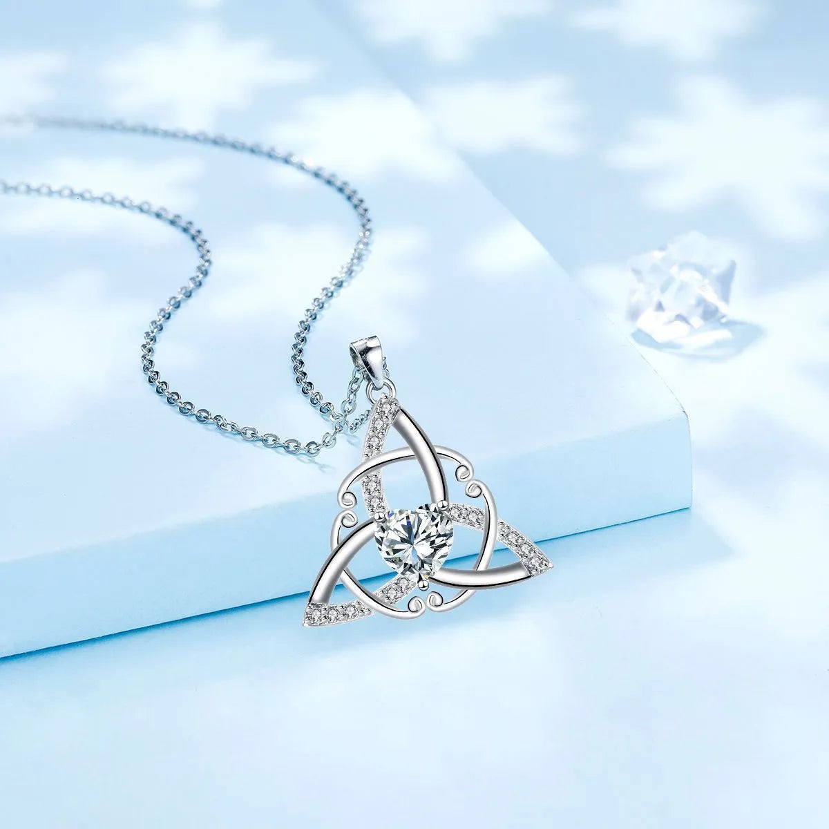 Geometric Celtic knot pendant necklace for women in electroplated copper, showing colour options.
