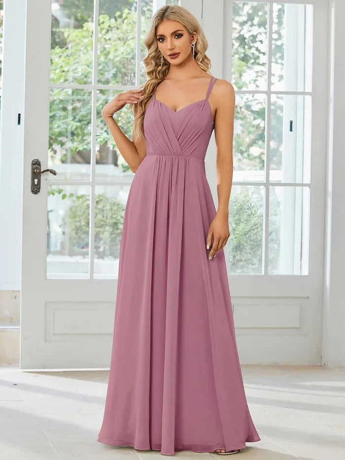 Women's long sleeveless A-line pleated dress in light green for banquet or casual wear.