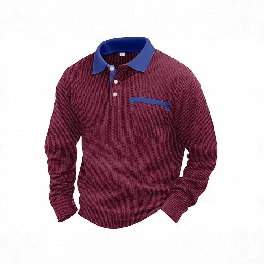 Man wearing a long-sleeve waffle-texture polo shirt in a loose retro fit, showing asymmetric design detail.