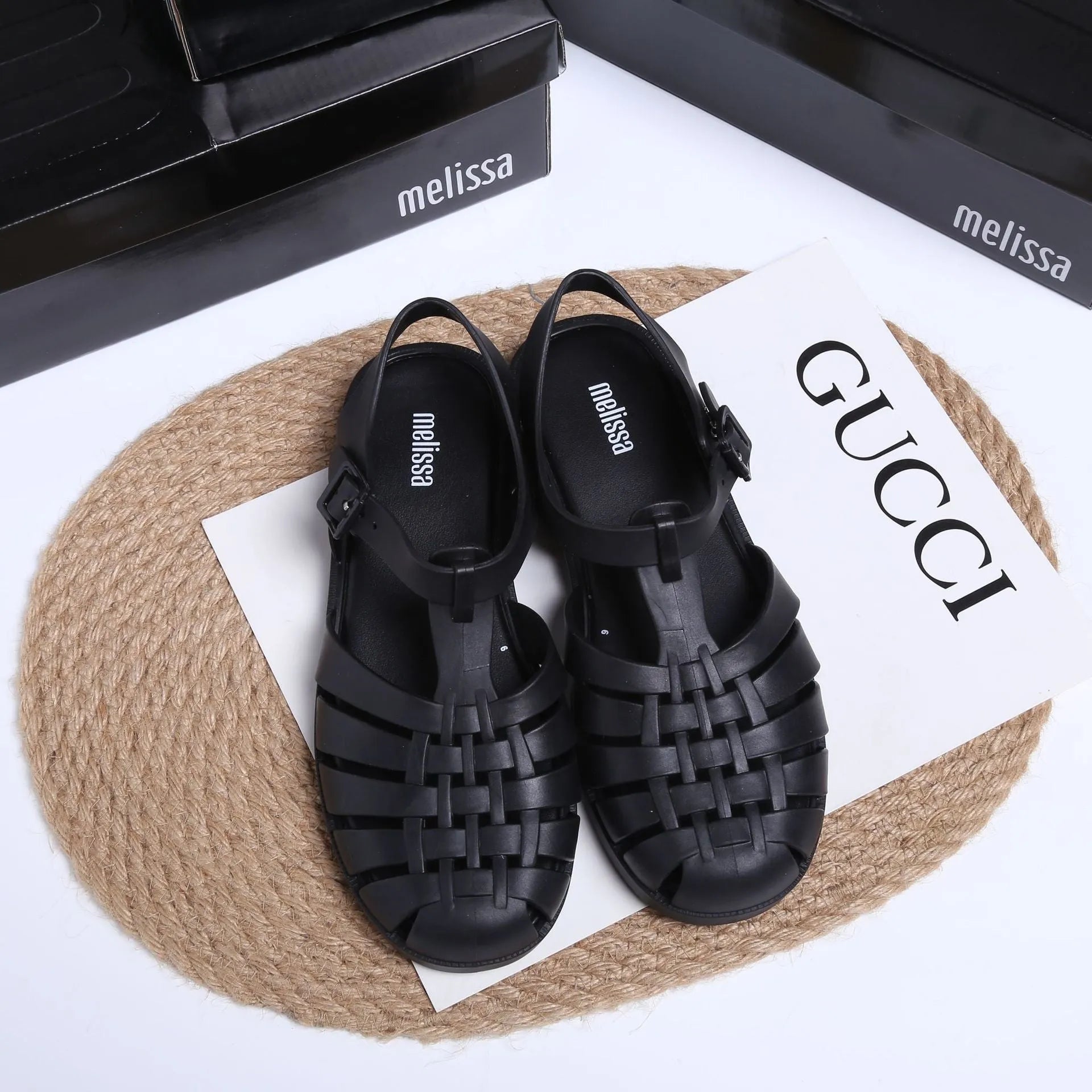 Vintage weave Roman sandals in matte black with buckle closure and round toe