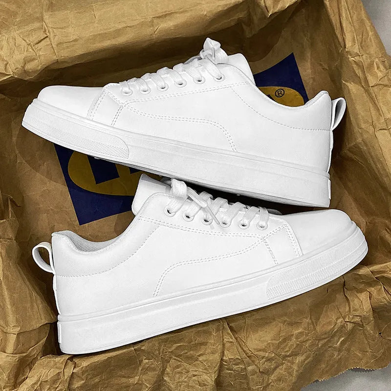 Men's low-top white breathable sneakers with a rubber sole on a plain background