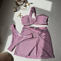 Women's one-shoulder tube top three-piece swimsuit set in glossy polyester fabric with matching skirt