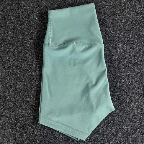 Ladies high-waisted yoga shorts in nylon fabric, shown in one of 16 available colours.