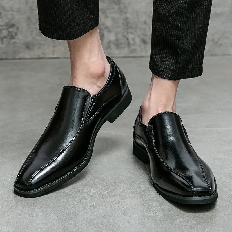 Men's black pointed leather casual shoes with flat rubber sole, shown from side