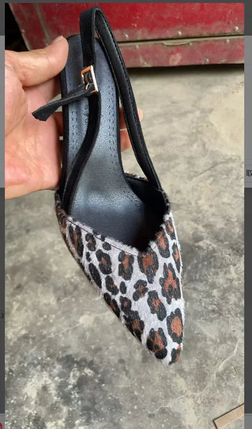 Women's leopard print suede pointed toe high-heel sandals with an adjustable ankle strap.
