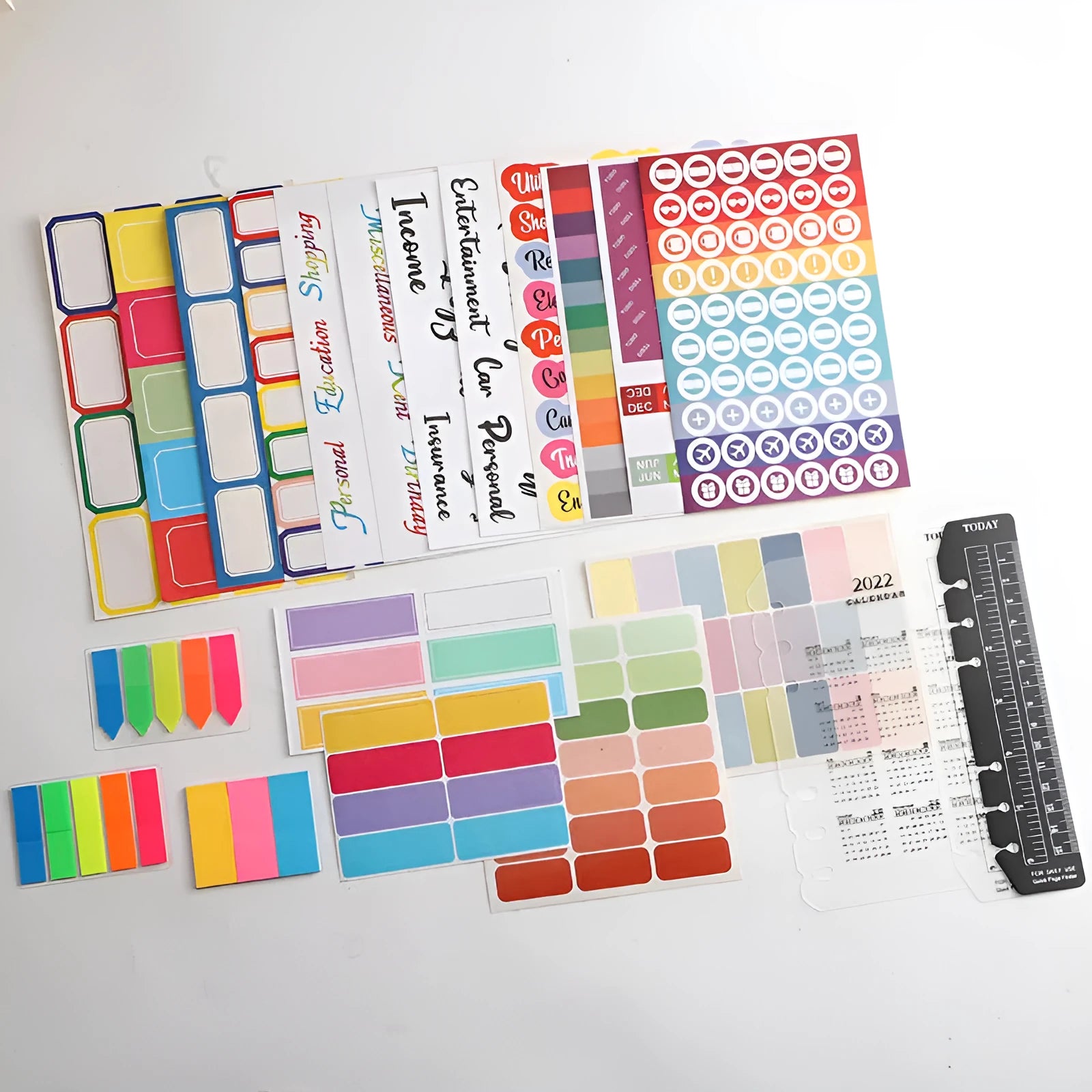 Assorted adhesive stickers and sticky notes showing grid formats and colourful designs with A6 ruler versions