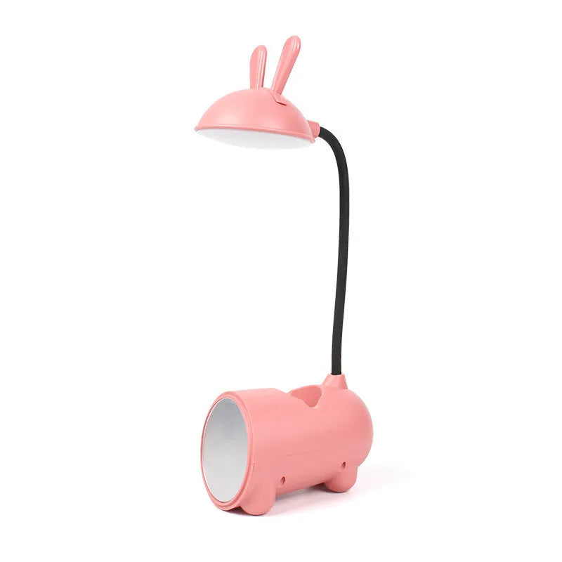 Green cartoon-themed USB table lamp with pen container base on desk