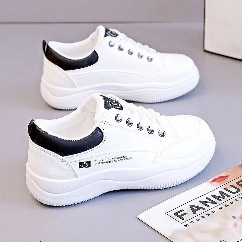 Women's white Korean-style lace-up shoes with cross straps and a mid heel on a rubber sole.