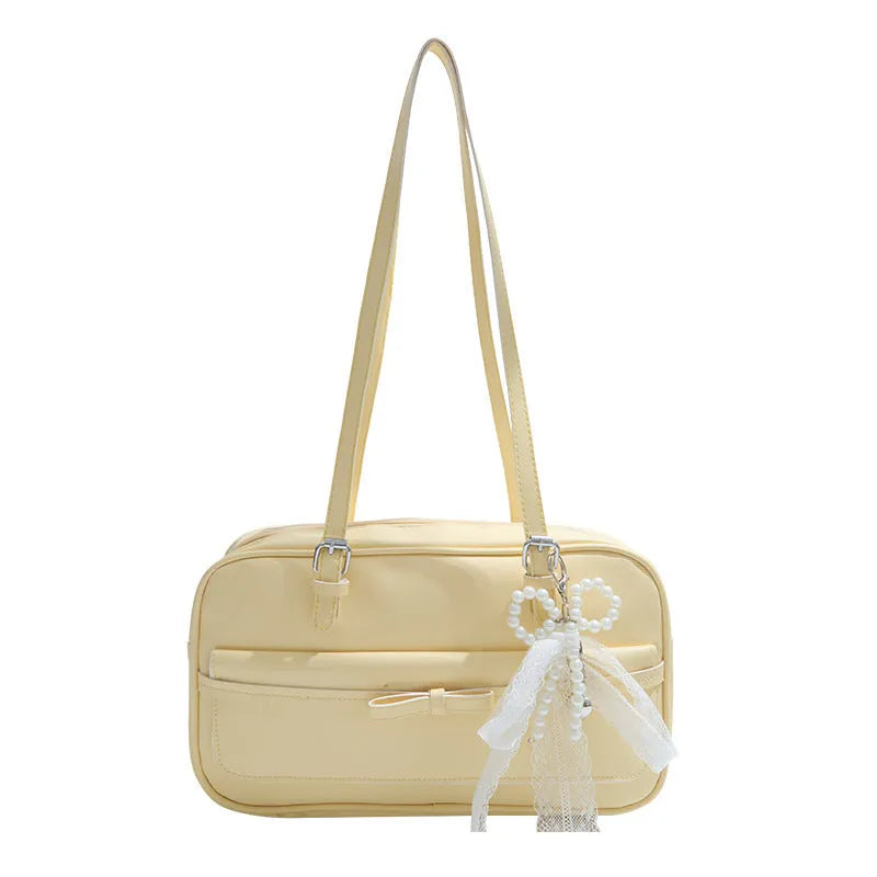 Women's black PU leather single shoulder flap bag with horizontal square shape and bow detail