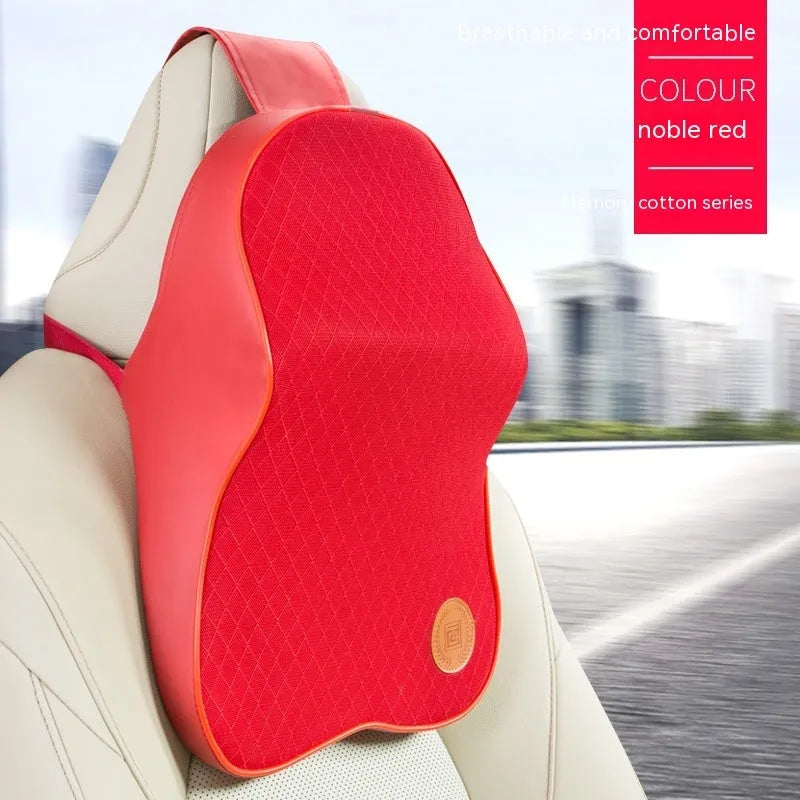 Black and brown memory foam car headrest and lumbar support pillows on a car seat.